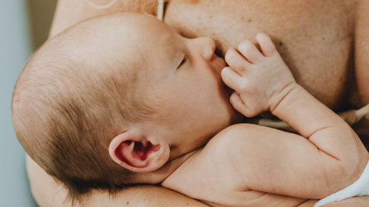 Newborn baby breastfeeding
