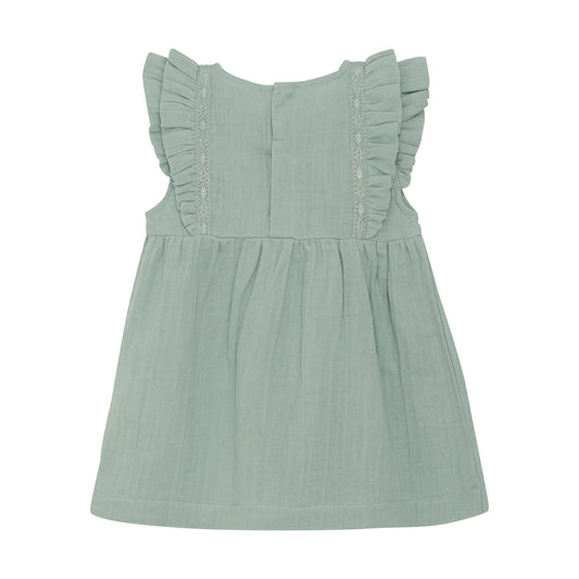 Flat back product image of a light green muslin baby dress