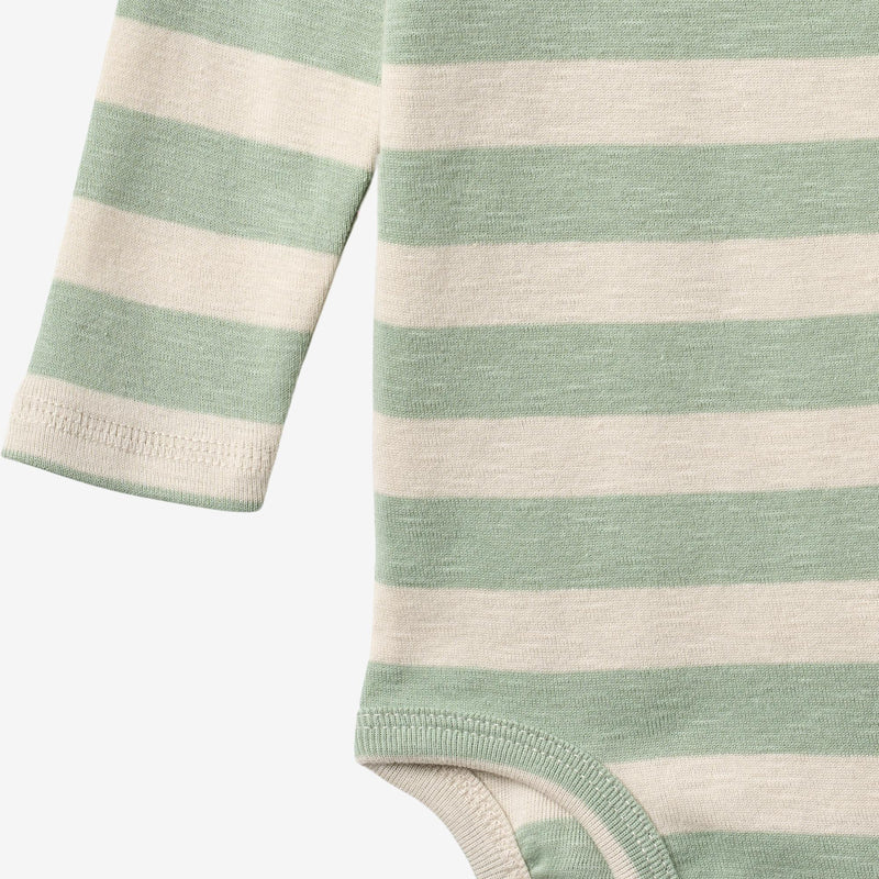 Close up product image of mint stripe baby bodysuit