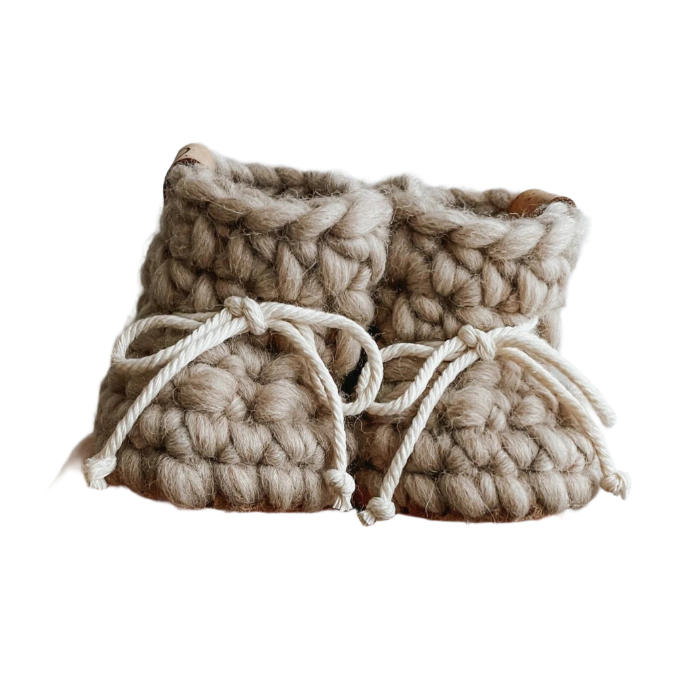 Wool knit baby slippers in a soft sand colour