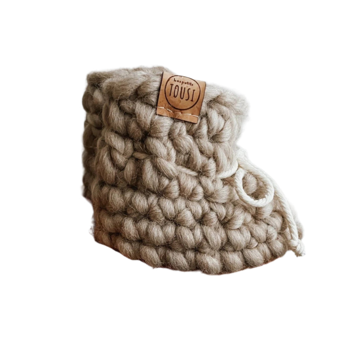 Wool knit baby slippers in a soft sand colour