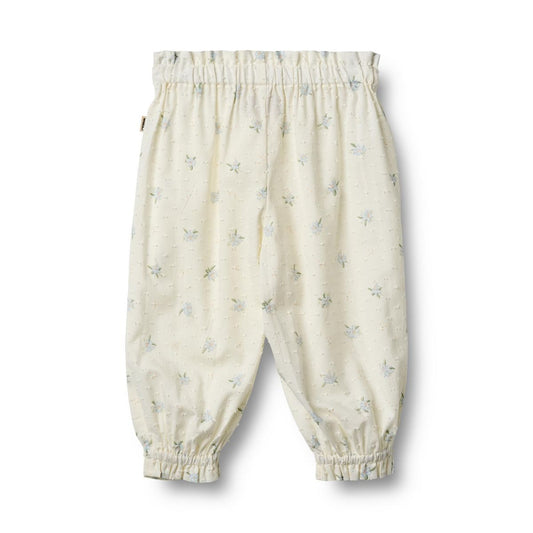 Flat back product image of woven cotton ruffle baby trousers