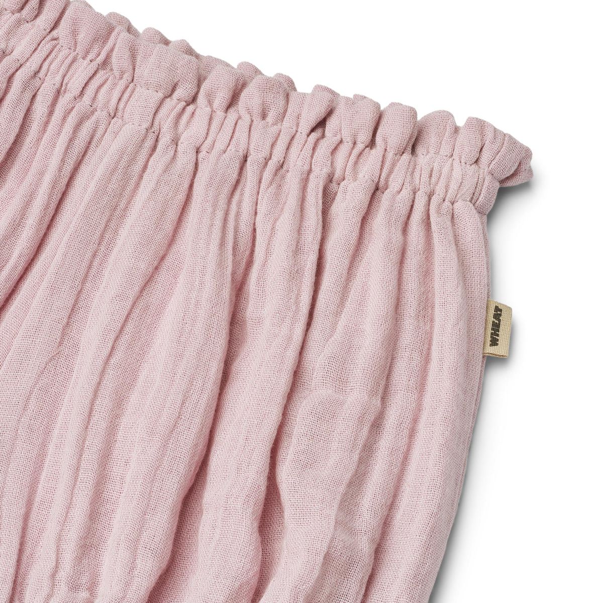 Close up product image of cotton muslin baby bloomer shorts