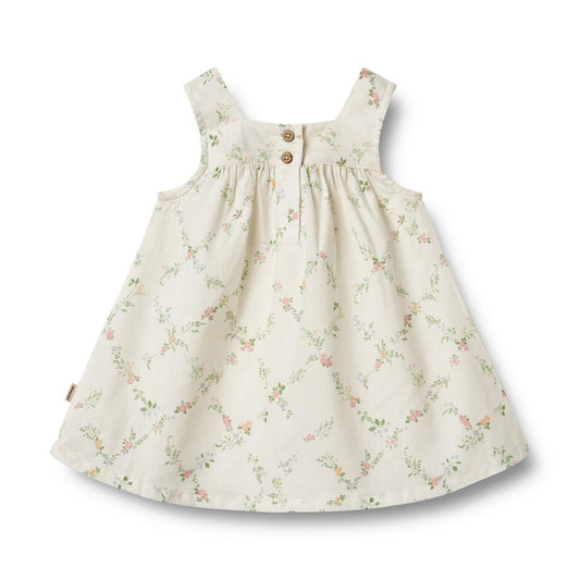 Flat back product image of a woven cotton baby dress