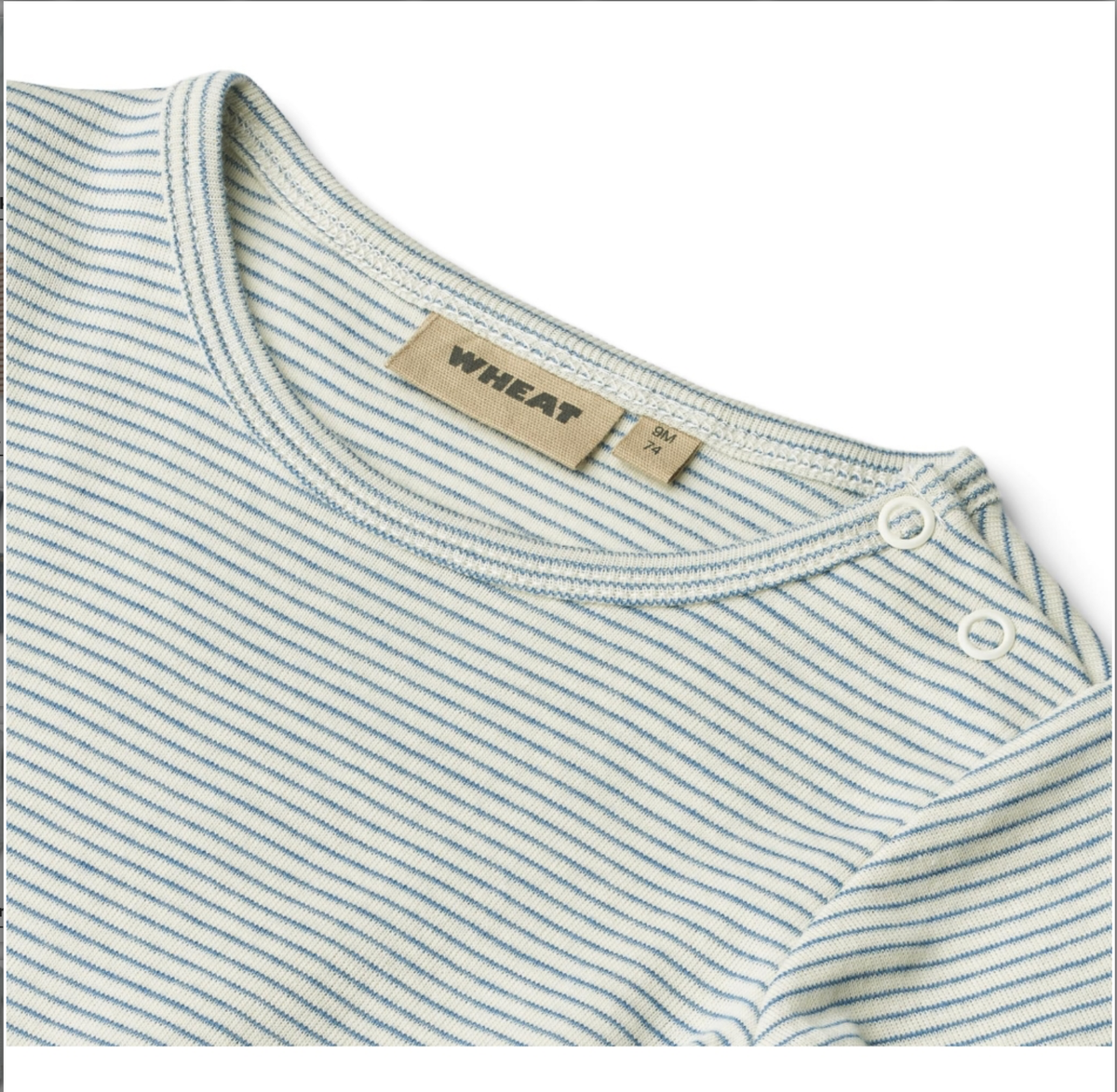 Close up product image of a long sleeve baby bodysuit