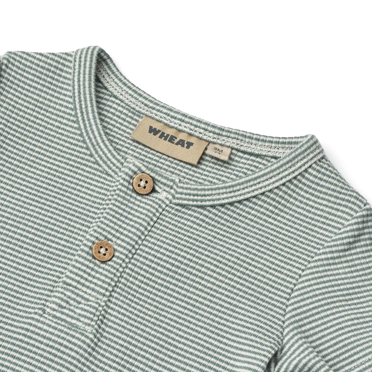 Close up product image of a short sleeve baby bodysuit