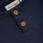 Close up product image of a navy short sleeve baby bodysuit
