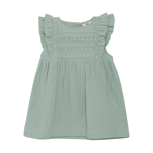 Flat front product image of a light green muslin baby dress