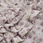 Close up product image of baby leggings in a light lilac floral print