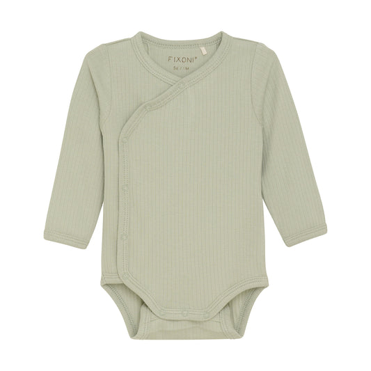 Flat front product image of a long sleeve wrap front baby bodysuit in soft green