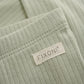 Close up product image of baby leggings in soft green