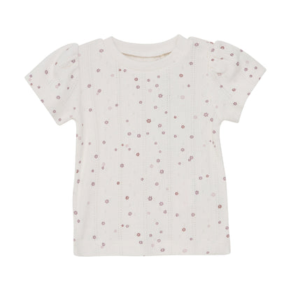 Flat front product image of an ivory pointelle baby tee with a purple daisy print