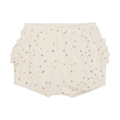 Flat front product image of ivory pointelle bloomer baby shorts with a purple daisy print