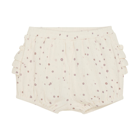 Flat front product image of ivory pointelle bloomer baby shorts with a purple daisy print