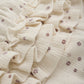 Close up product image of ivory pointelle bloomer baby shorts with a purple daisy print