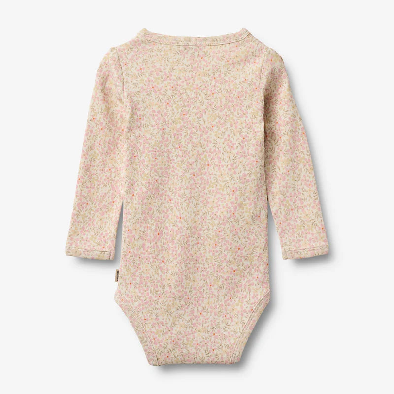 Flat back product image of floral baby wrap bodysuit