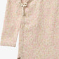 Close up product image of floral baby wrap bodysuit