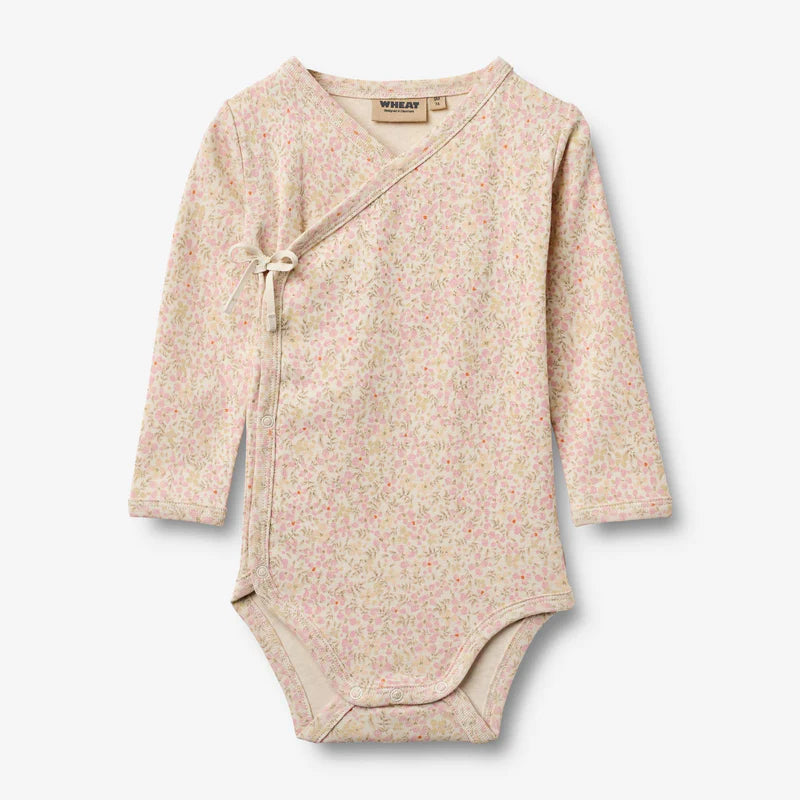 Flat front product image of floral baby wrap bodysuit
