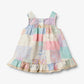 Flat back product image of patchwork baby dress with ruffles