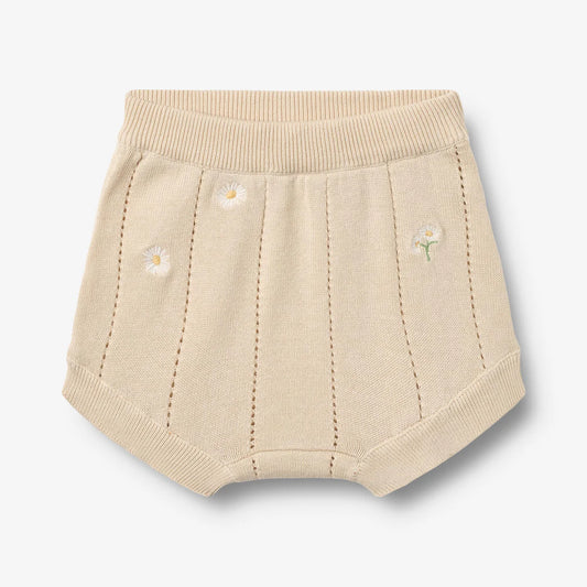Flat front product image of pale yellow knit baby shorts