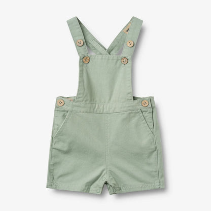 Flat front product image of teal baby overalls