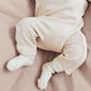 Lifestyle product image of a closeup on a pile of childrens sweaters