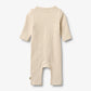 Flat back product image of pale peach baby wrap romper