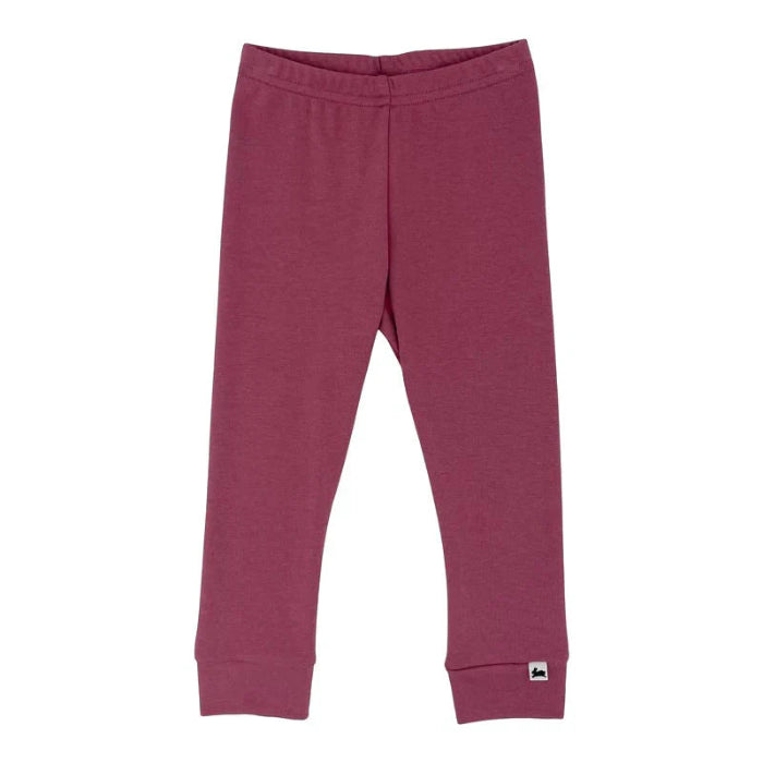 flat lay of a pair of pomegranate colored baby leggings