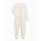Product image of an ivory zippered sleeper with a polka dot print