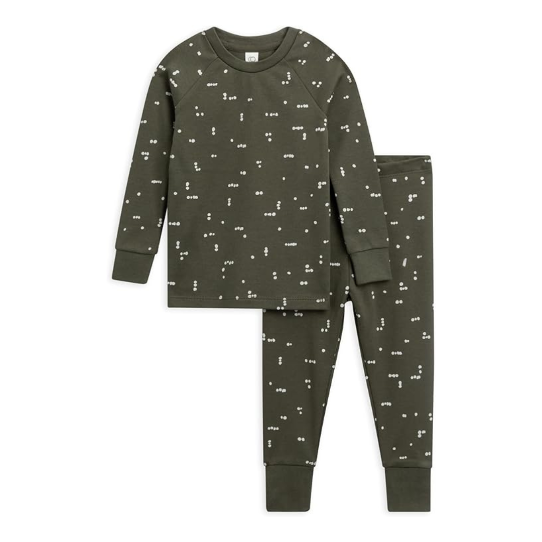 flat lay of a toddler two-piece pyjama set in dark green with white dots