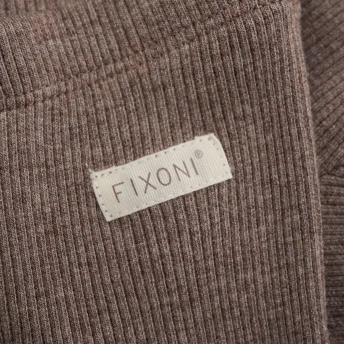 Close up image showing ribbed texture on warm brown baby leggings