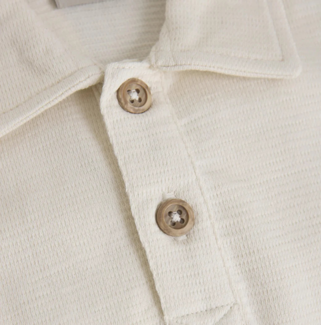 Close up product image of a baby bodysuit