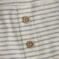 Close up product image of baby leggings with two small wooden buttons in light grey stripes on ivory