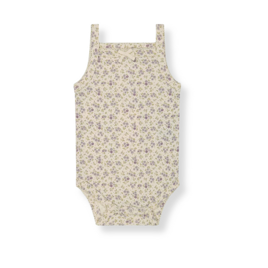 flat lay of a baby singlet bodysuit with a floral pattern