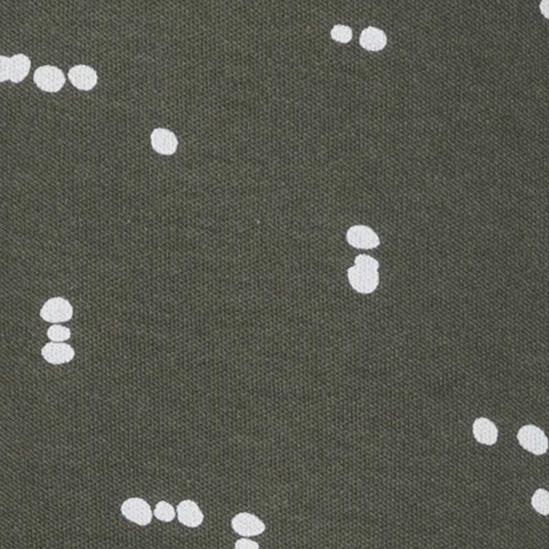 pattern detail of white abstract dots on a dark green background