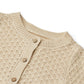 Close up product image of a knit button front baby cardigan