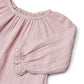 Close up product image of a long sleeve cotton muslin blouse
