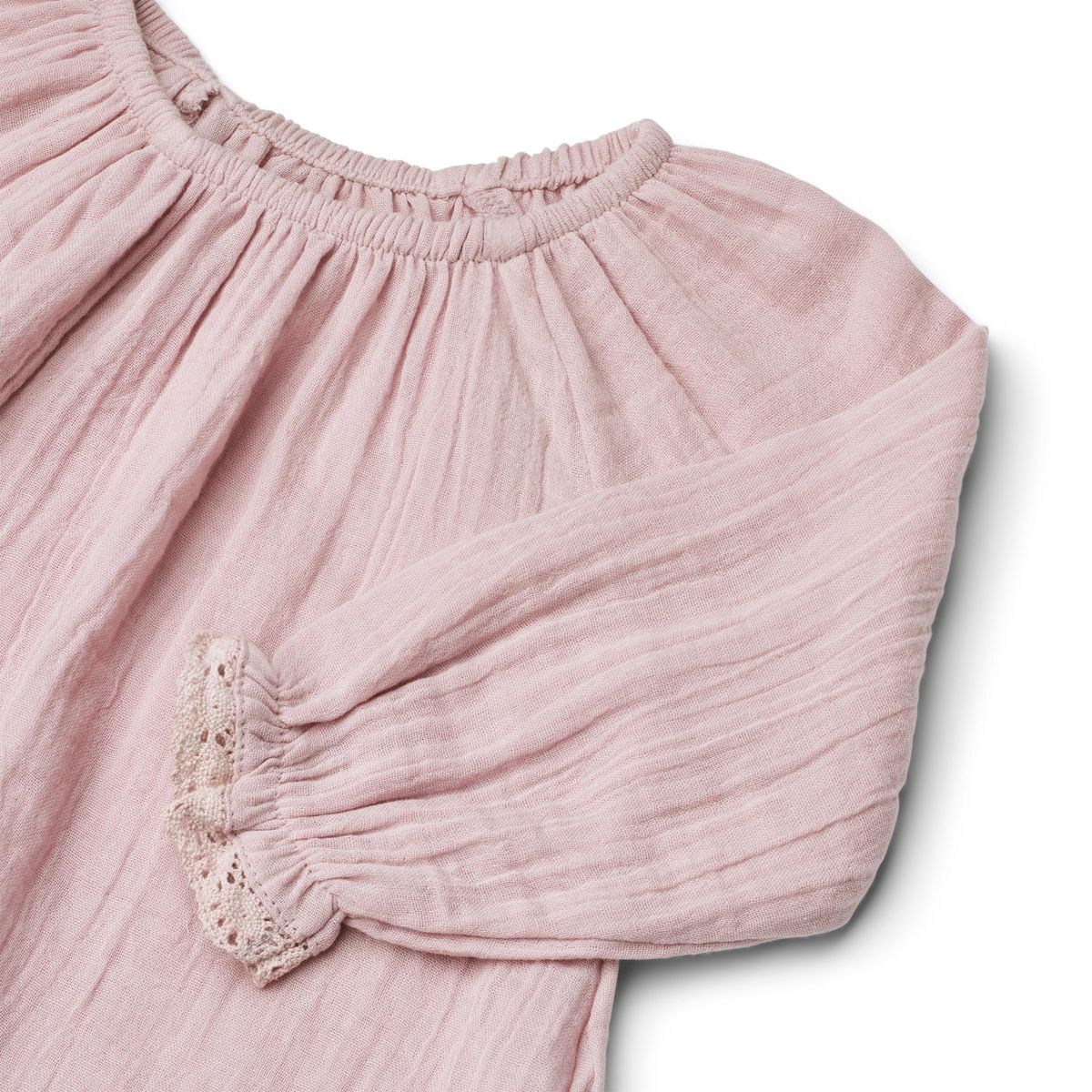 Close up product image of a long sleeve cotton muslin blouse