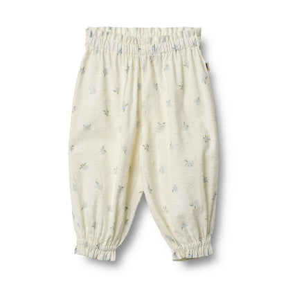 Flat front product image of woven cotton ruffle baby trousers