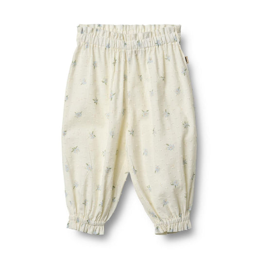 Flat front product image of woven cotton ruffle baby trousers