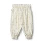 Flat back product image of woven cotton ruffle baby trousers
