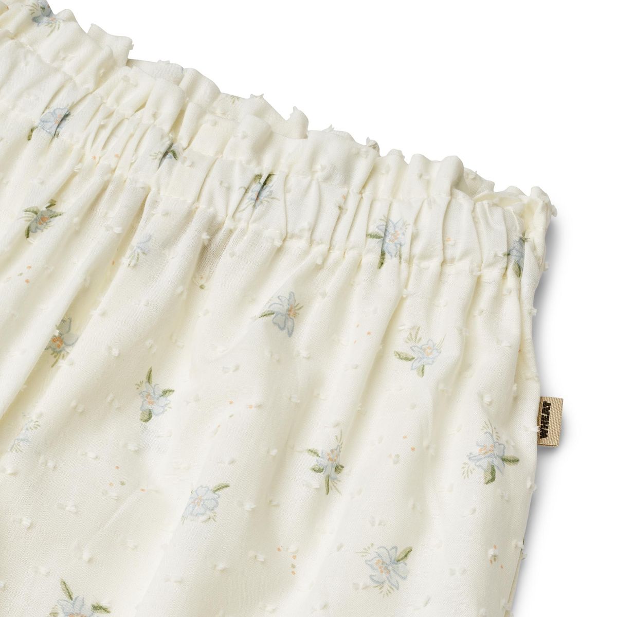 Close up product image of woven cotton ruffle baby trousers
