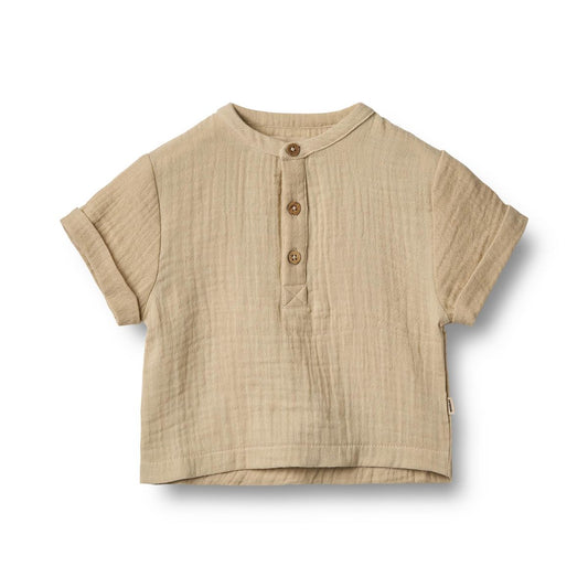 Flat front product image of a woven relaxed fit baby shirt