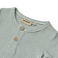 Close up product image of a short sleeve baby bodysuit