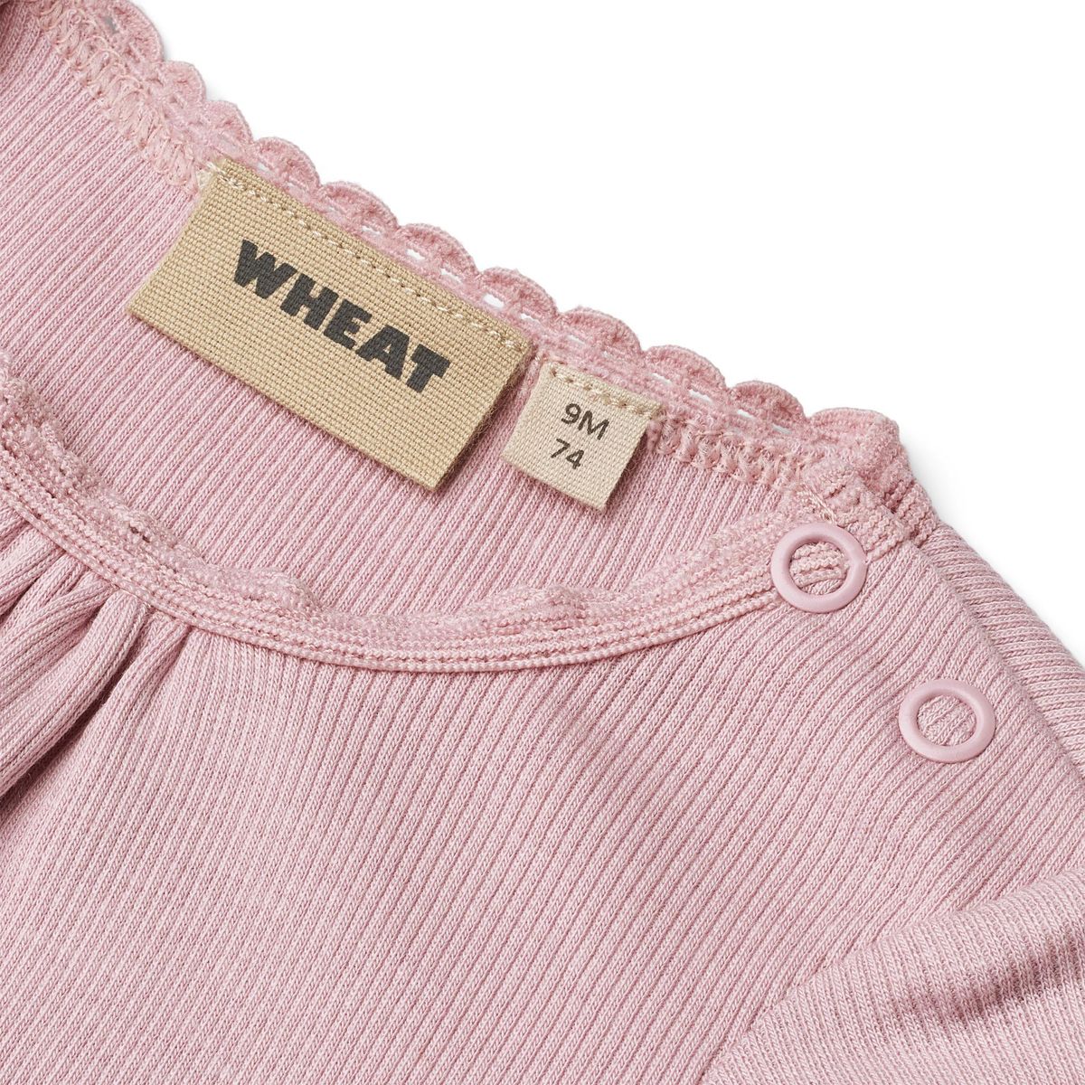 Close up product image of a short sleeve baby bodysuit