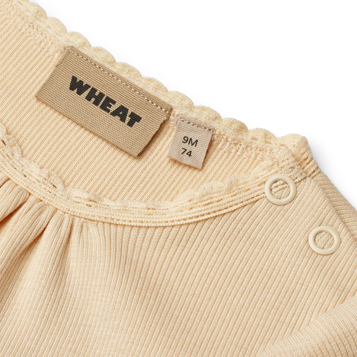 Close up product image of a short sleeve baby bodysuit