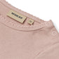 Close up product image of a long sleeve baby bodysuit